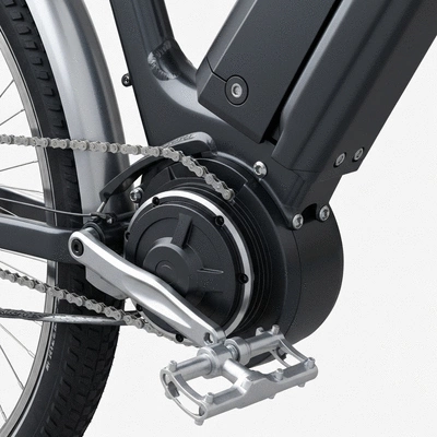 Close up of an electric bike motor and pedal-assist sensor